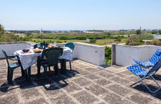 Villa 'Punta Prosciutto Vista Mare' con vistas al mar, Wi-Fi y aire acondicionado