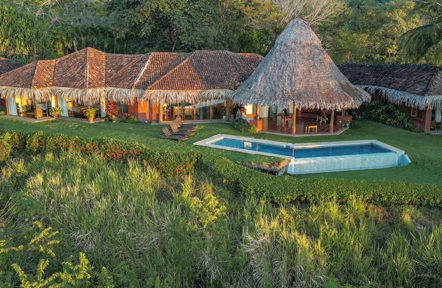 Walk to the beach from 4 bedroom house w/ salt water infinity pool.