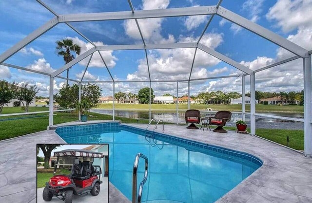 Premier home with Heated Pool, Waterfront, 2 king beds & 4 person golf cart.