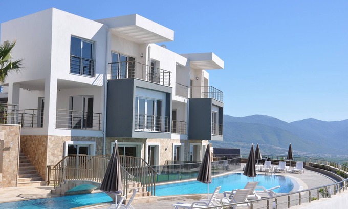 Sogucak Apartamento | Apartamento de lujo 1 + 1 en Kusadasi Sogucak, frente al mar Egeo de color turquesa