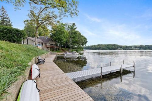 Newaygo Casa | 2 Lakefront Cottages with Docks, Bikes, BBQ