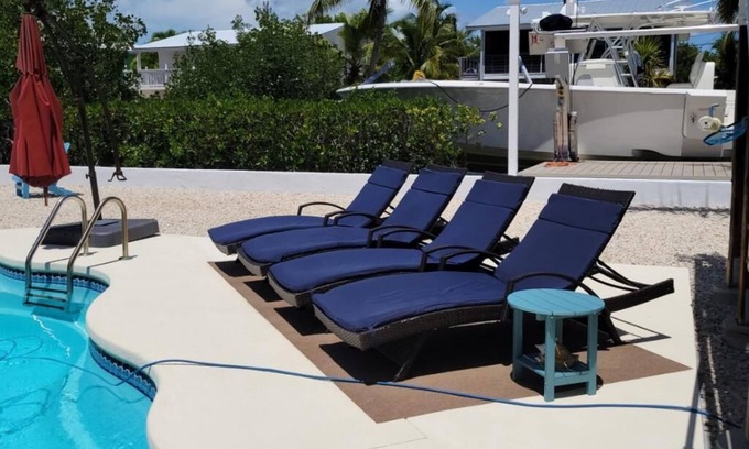 Breezeswept Beach Estates Casa | 3/2 two story home with pool and 80' dock on canal ocean side.