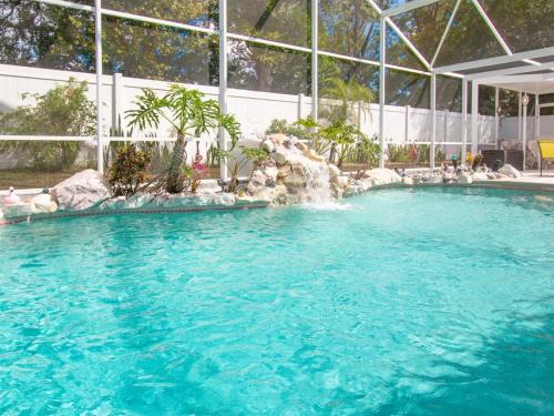 Chatham Park Casa | 3 Bedroom Home With Private Screened Pool With Rock Waterfall Feature And Gameroom By Florida Dream Homes