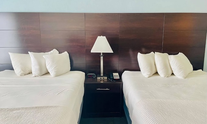 Cuero Casa | 3 Double Queen With Kitchenette at FairBridge Inn & Suites Cuero, Pet-Friendly!
