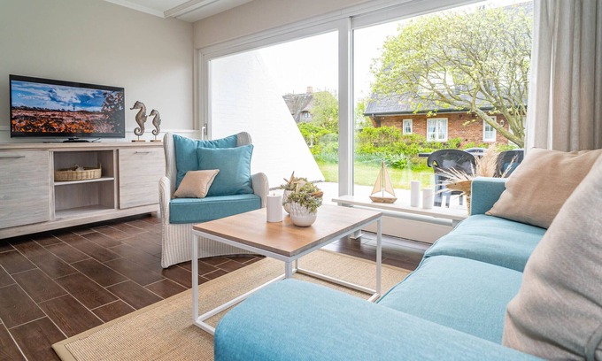 Wenningstedt-Braderup Apartamento | 3-room vacation apartment with terrace - only 600 meters to the beach.