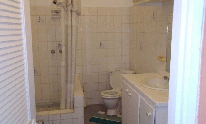 Bois d'Orange Condominio | 4 separate single bedrooms,bathrooms,living and kitchen.beach access