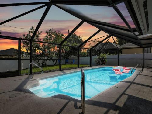 Naples Park Villa | 4BD Beach House Heated Pool Sleeps 14