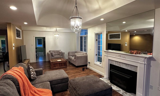 West End Casa | 5-bedroom oasis in central St. John's, featuring a deck overlooking lush greens.