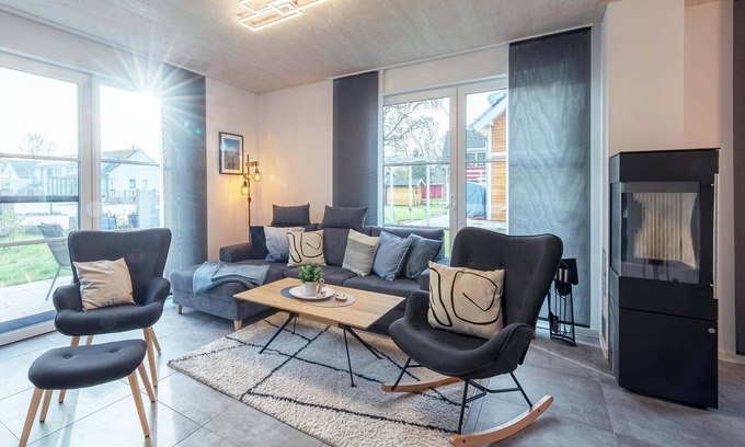 Fuhlendorf Casa | 5-star vacation home Ostseetraum on the water with fireplace, terrace and Bodden view