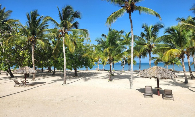 San Pedro de Macoris Apartamento | A dreamy vacation apartment, steps from private beach.