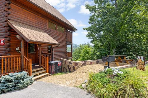 Gatlinburg - Pigeon Forge Casa | A Taste Of Honey is a dog-friendly two bedroom true log cabin nestled inside the Starr Crest resort