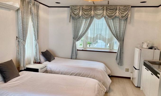 Hamada Casa | A triple room with a spectacular oceanfront view sunset right in front of you and plenty of amenit / Hamada Shimane