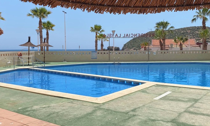Puerto de Mazarrón Apartamento | Accessible apartment 50 metres to beach ,large communal pool, sea view balcony
