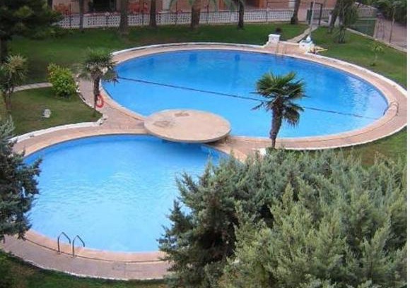 Daimuz Apartamento | Acogedor apartamento en Daimús a 150 metros de la playa con parking privado y piscinas comunitarias