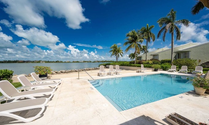 Key West Casa | 3BD/2BA Waterfront Townhome w/ Open Water Views, Beach, and Waterside Pool.