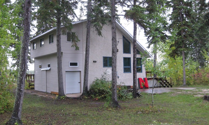 The Pas Casa | ¡La aventura te espera en este retiro junto al lago, # 9 Rocky Lake North!
