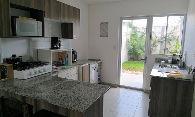 Guácima Casa | Alajuela Stay: Close to Airport, Viva Park & CAR with amenities like pool & gym