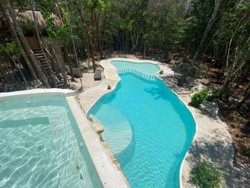 Puerto Morelos Otro | Aldea Maya-Ha Cabañas con cenotes