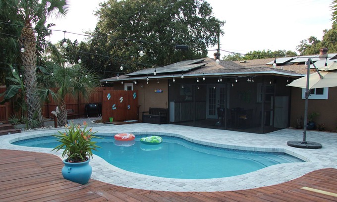Crooked Creek Casa | Amazing home with heated pool, tiki bar and luscious outdoor close to beaches