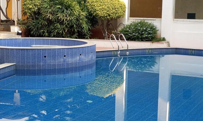 Bengaluru Casa | Amazistay offers Luxury room with private bathroom, balcony & 55 inch TV & shared Jacuzzi paid access, Book Lover, near Ramaiah College Hospital