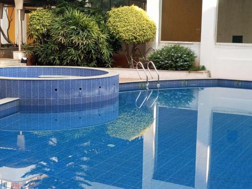 Bengaluru Casa | Amazistay offers Posh room for two with private balcony & bathroom & TV, Traveller, with shared Jacuzzi paid access near Brigade Senate
