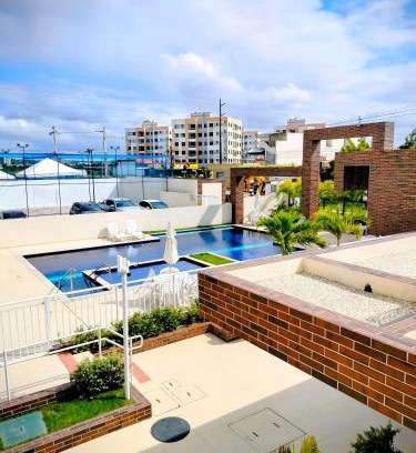 Aruanda Apartamento | Apê Prime Confort 2 quartos com ar, vista piscina - a 6min da praia de Aruana