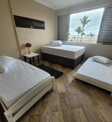 Guilhermina Apartamento | Apartamento Aconchego Frente Mar - Vila Guilhermina Praia Grande SP - Cozinha Completa - Climatizador de Ar - TV a Cabo - Wi-Fi