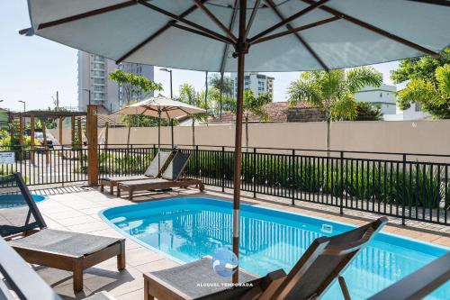 Picarras Casa | Apartamentos em Bal Piçarras 150 M DA PRAIA com Sacada Wi Fi, Piscina, Portaria 24h, Playground e vaga de GARAGEM