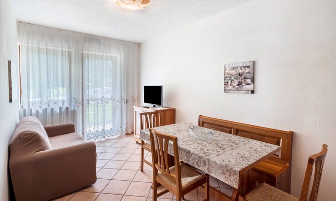 Rocca Pietore Apartamento | Apartamento 'Appartamento Bilocale 2' con vistas a la montaña, jardín compartido y Wi-Fi
