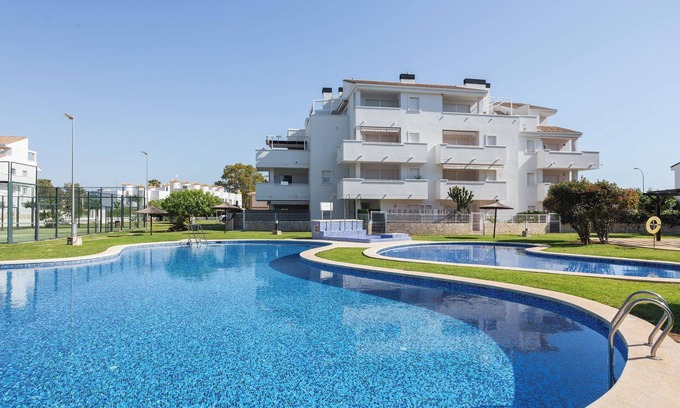 Les Deveses Apartamento | Apartamento 'Entre Olas 2' con piscina compartida, terraza privada y aire acondicionado.