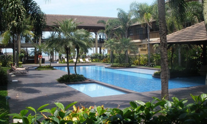 Enseada Condominio | Apartamento en condominio de estilo polinesio frente al mar - 1 suite