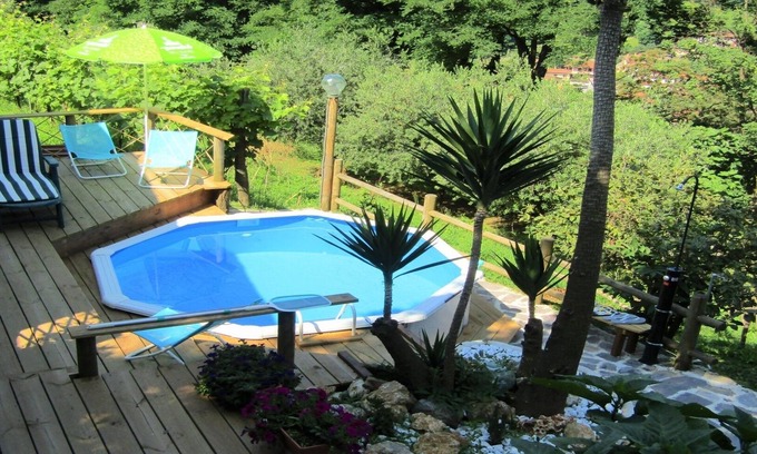 Strettoia Casa | En las colinas. Porción de una villa adosada con piscina y vistas al mar.