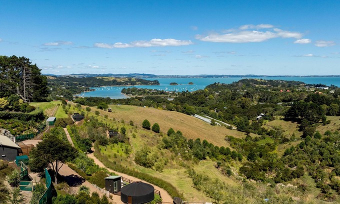 Palm Beach Cabina | Awaawa Yurts - Tane Yurt - Awaawa Yurts offer a luxury glamping experience on Waiheke Island. Stunning views, luxury queen sized bed, private bathroom with tea and coffee making facilities.