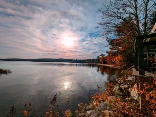 Sullivan Casa | Back of the Moon Lakefront Camp family watersports fire pit 1 dog beach sleeps 8