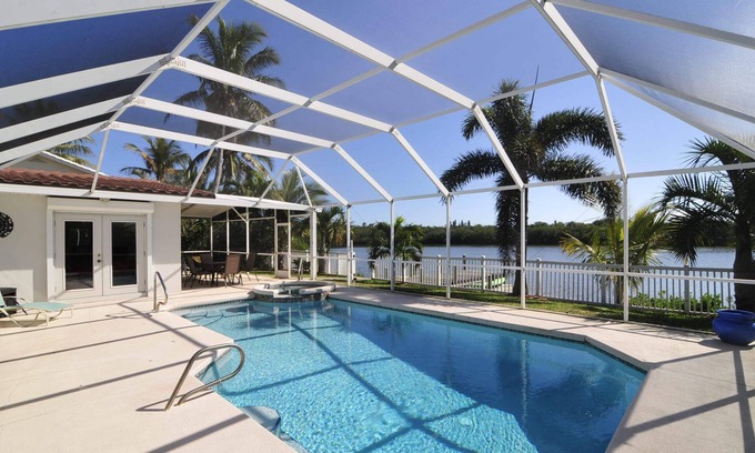 Port Canaveral Casa | Banana River Beauty-Five bedroom waterfront home with heated pool and spa