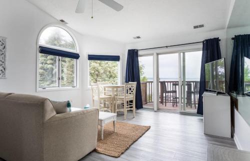 Traverse City Casa | Beach 321 with Vaulted Ceilings Pool Hot Tub and Stunning Views from Private Deck