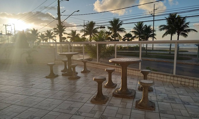 Praia Grande Apartamento | Beachfront condominium, 1-bedroom apartment with views of the mountains and sunset