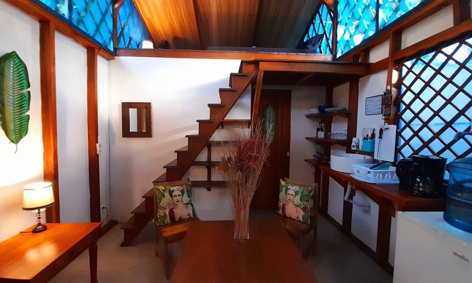 Manzanillo Cabina | Beachfront Casita for 2, loft-style double bed & kitchenette with shaded porch