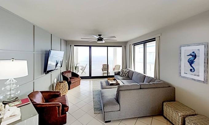 Orange Beach Condominio | Beachfront corner condo with pools, a hot tub, tennis, & sauna