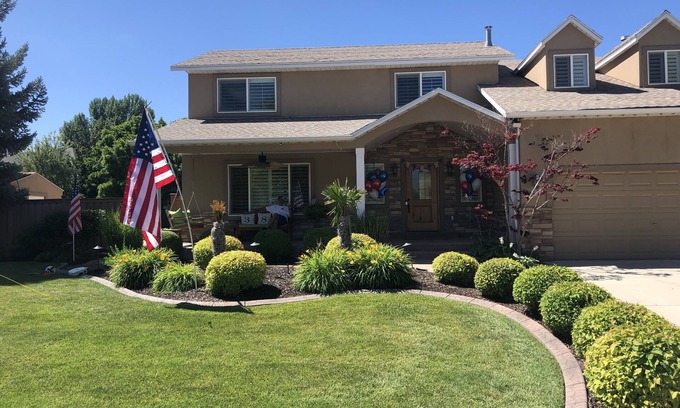 River Bottoms Casa | Beachy Home in Provo. Large deck with builtin hot tub, Fire pit, Palapa