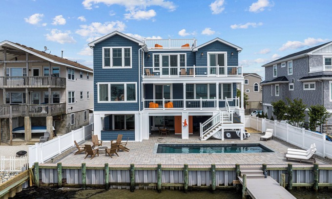 Ship Bottom Casa | Beautiful Bayfront w/ Heated Pool & Dock. 6 Bedrooms, all w/ Ensuite Bathrooms.