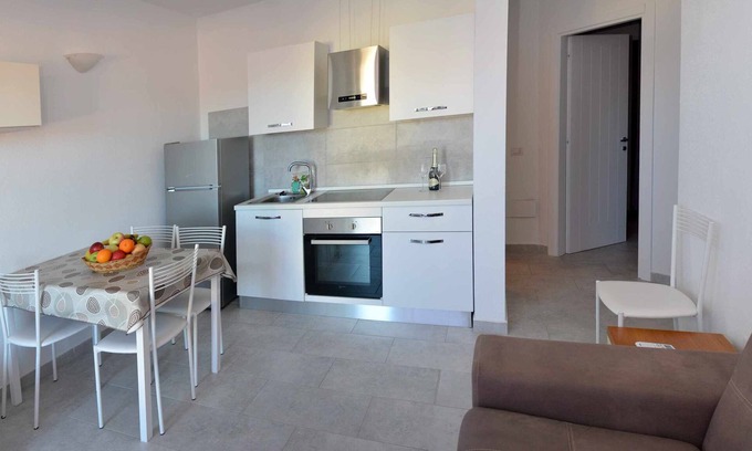 Porto Pozzo Apartamento | Luminoso trilocale con vista mare - Residence Eolo