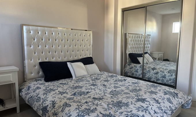 San Fernando Casa | Bedroom and bathroom in a quiet townhouse.