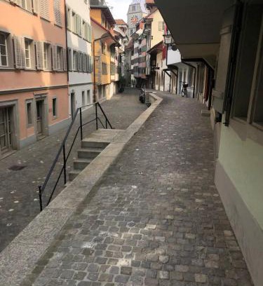 Zug Casa | Bedroom cum office with shared shower in Zug's Old Town