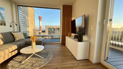 Marienleuchte Apartamento | BeltBlick 30 – Moderne Ferienwohnung mit Dachterrasse direkt an der Ostsee!