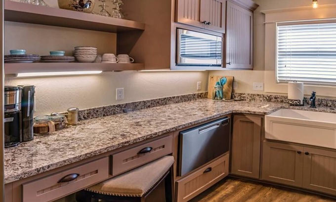 Historic Railroad District Casa | BookStayHop -RedTail Orliena Suite, Relaxing Hot tub and a Tesla Station