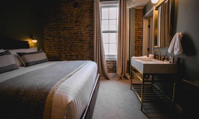 Jacksonville Hotel | Boutique 1 BR King Suite in historic downtown Jacksonville. Walk to the Britt Festival! Enjoy a king bed, modern rain shower, and charming Inn details. Ideal for a romantic or weekend getaway.