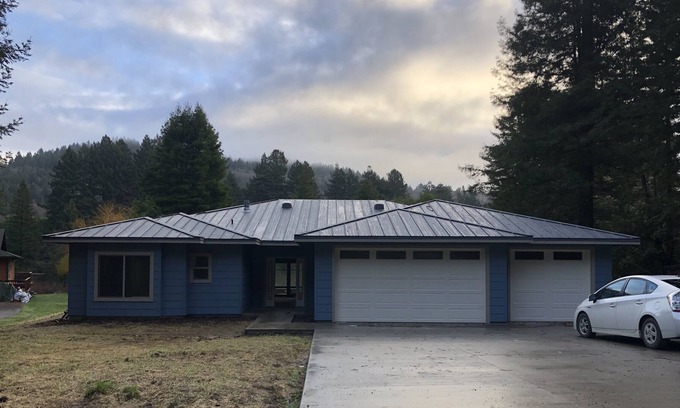Crescent City Casa | Bright, open concept, family friendly house, private sandy beach on the river