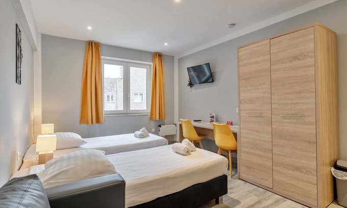 Leuven Apartamento | Estudio de negocios con dos camas individuales en Budget Flats Leuven