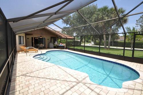 Palm Harbor Casa | Canal Front Pool Home in Palm Coast